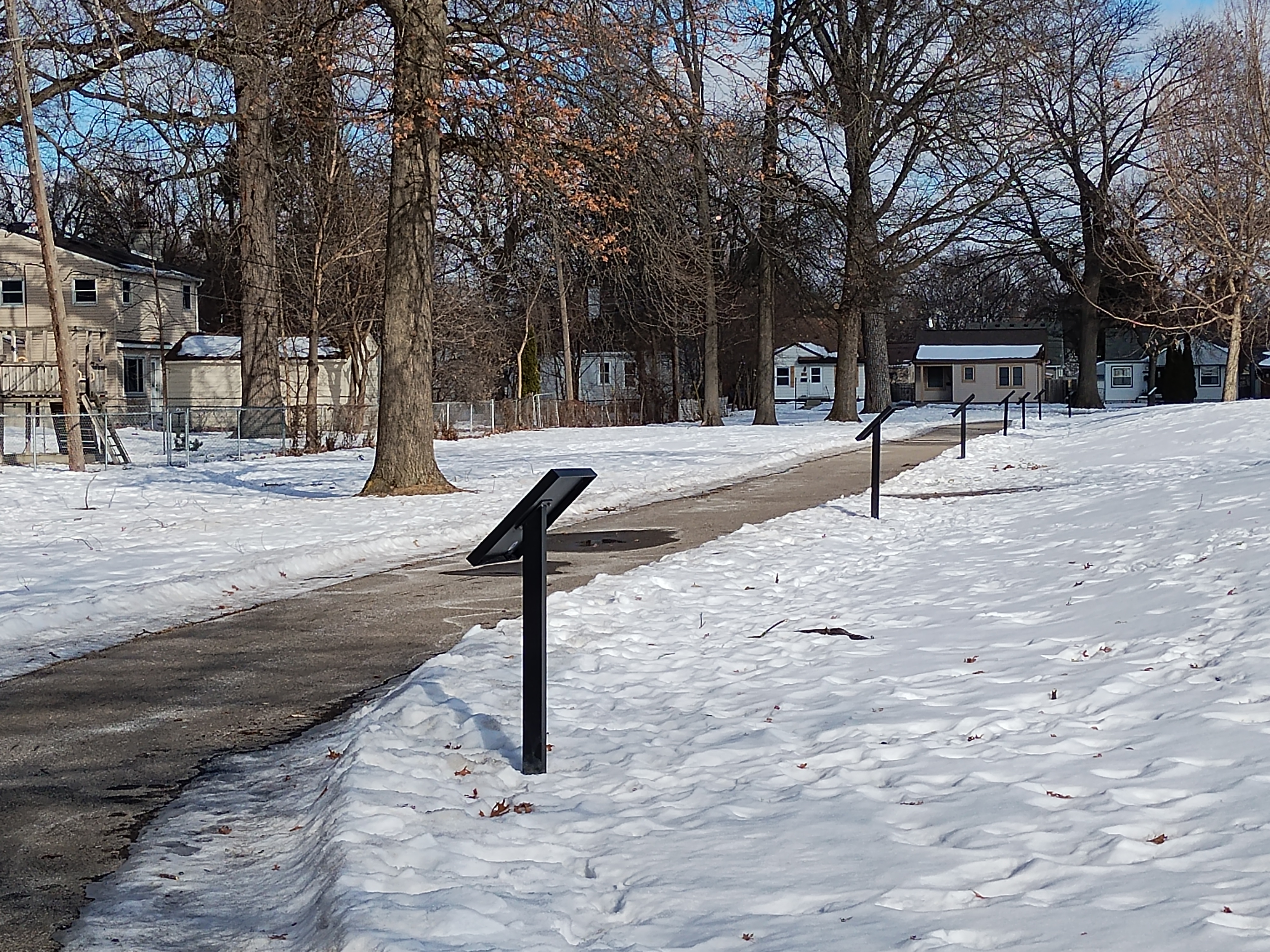 Story trail path at Martin Road Park with the road Woodward Heights in the distance.
